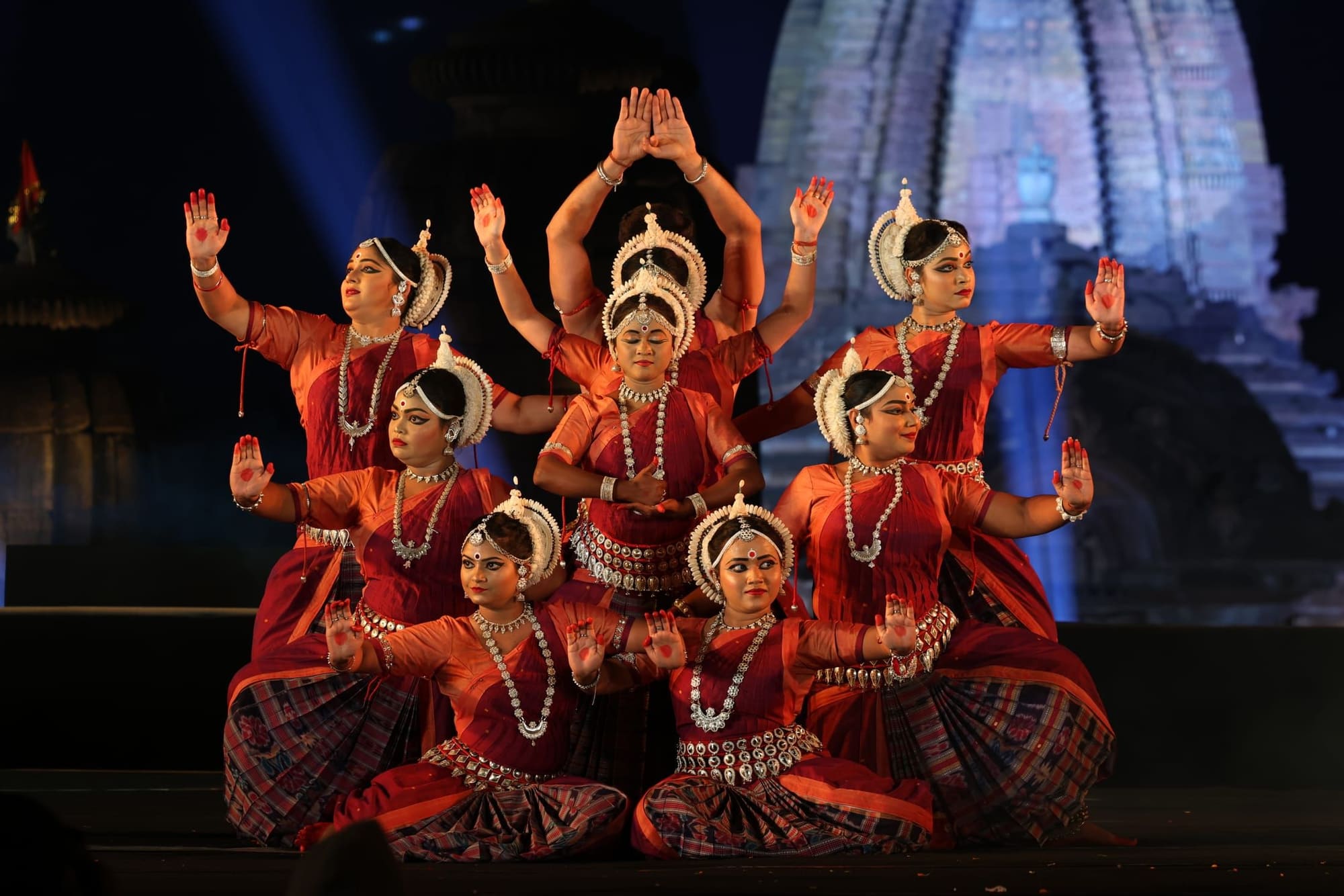 Full ensemble Odissi performance with Konark temple projection backdrop