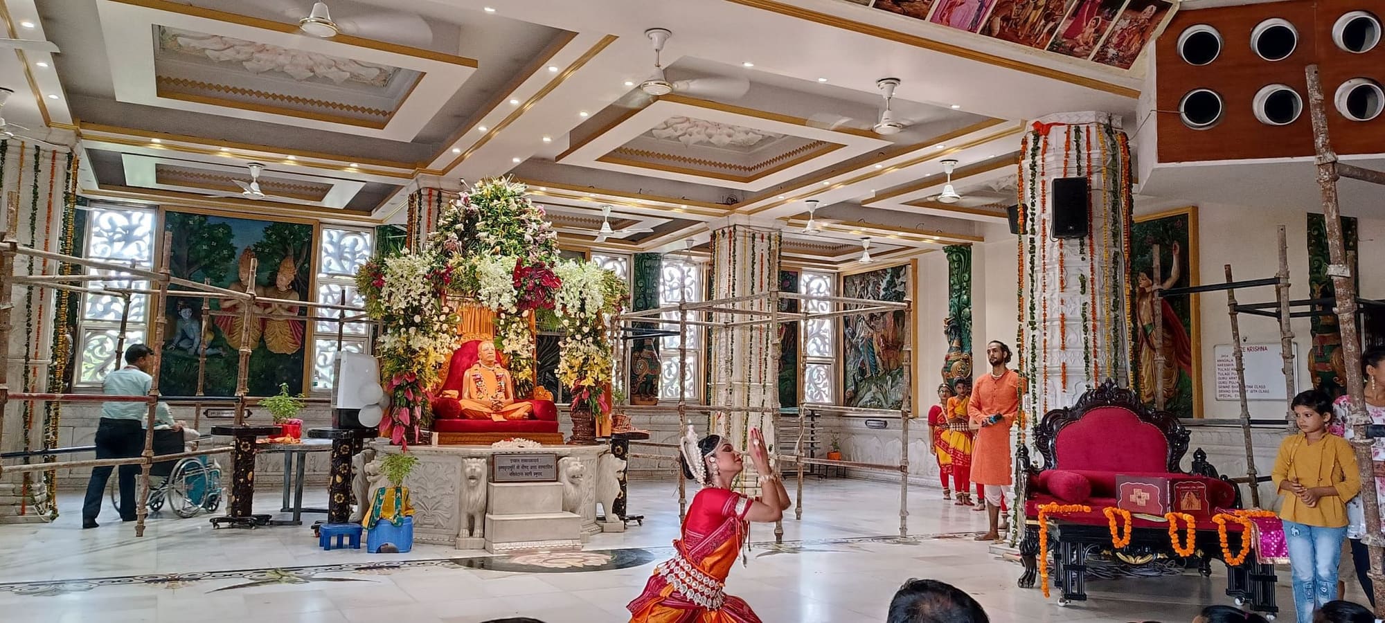 Solo Odissi performance inside a temple hall before the guru murti