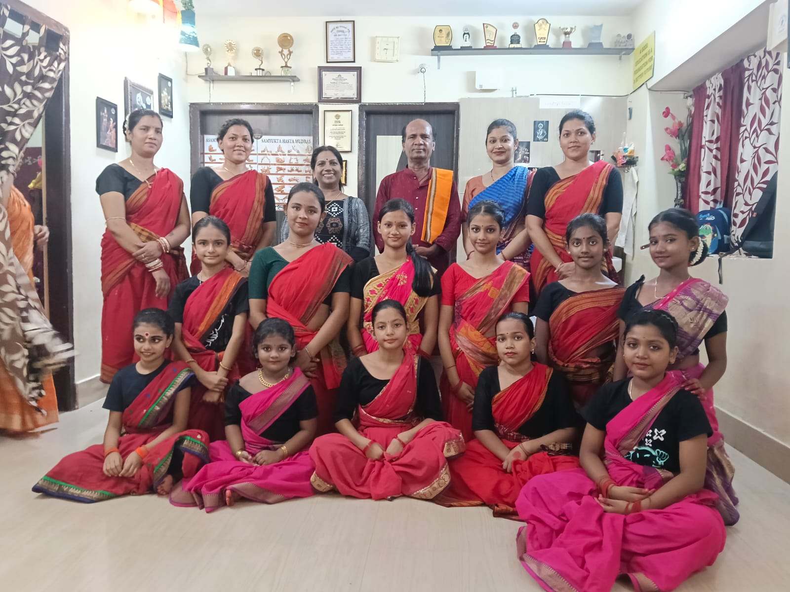 Summer batch students and teachers together in a group portrait at the studio